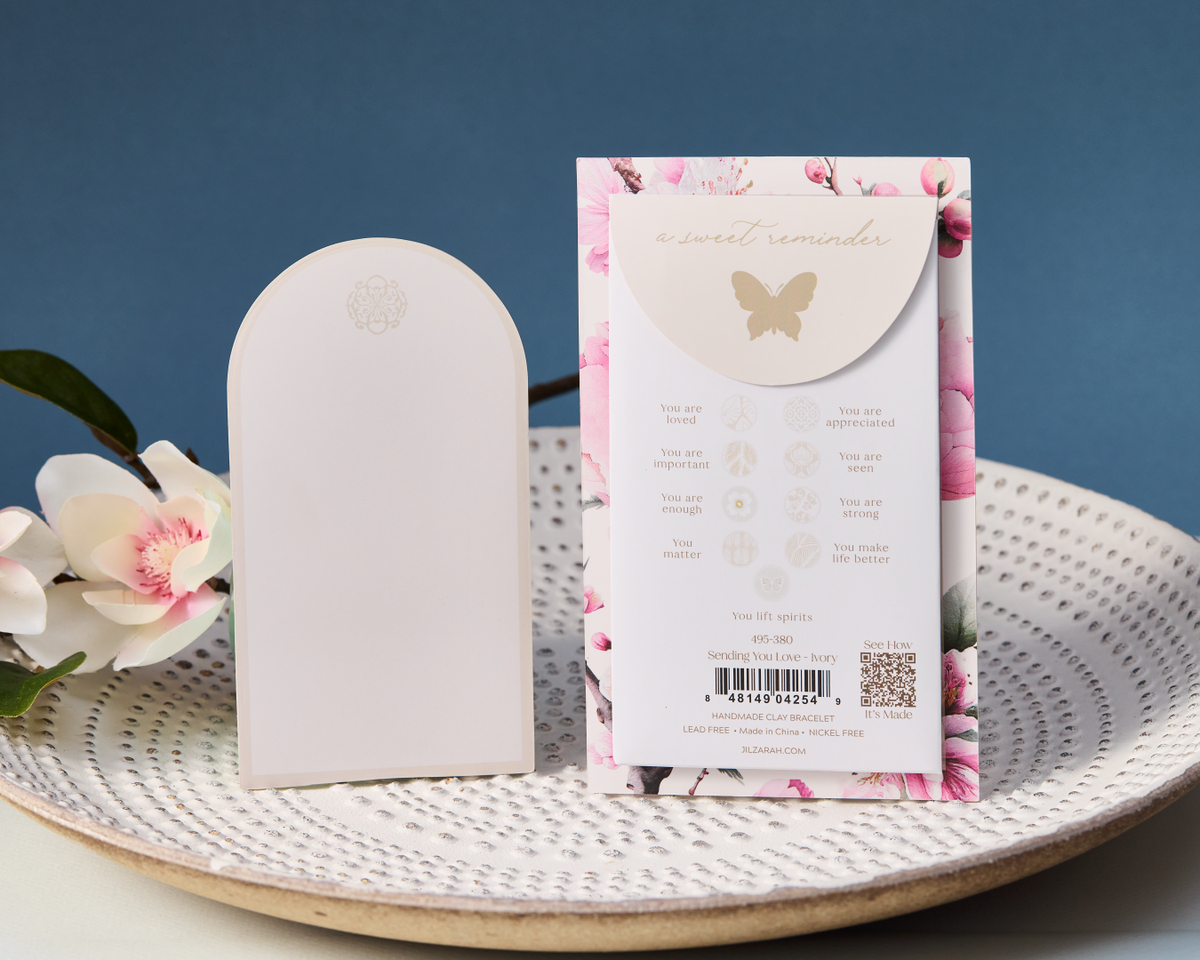 The blank gift card and the back of the bracelet card with its nine bead meanings